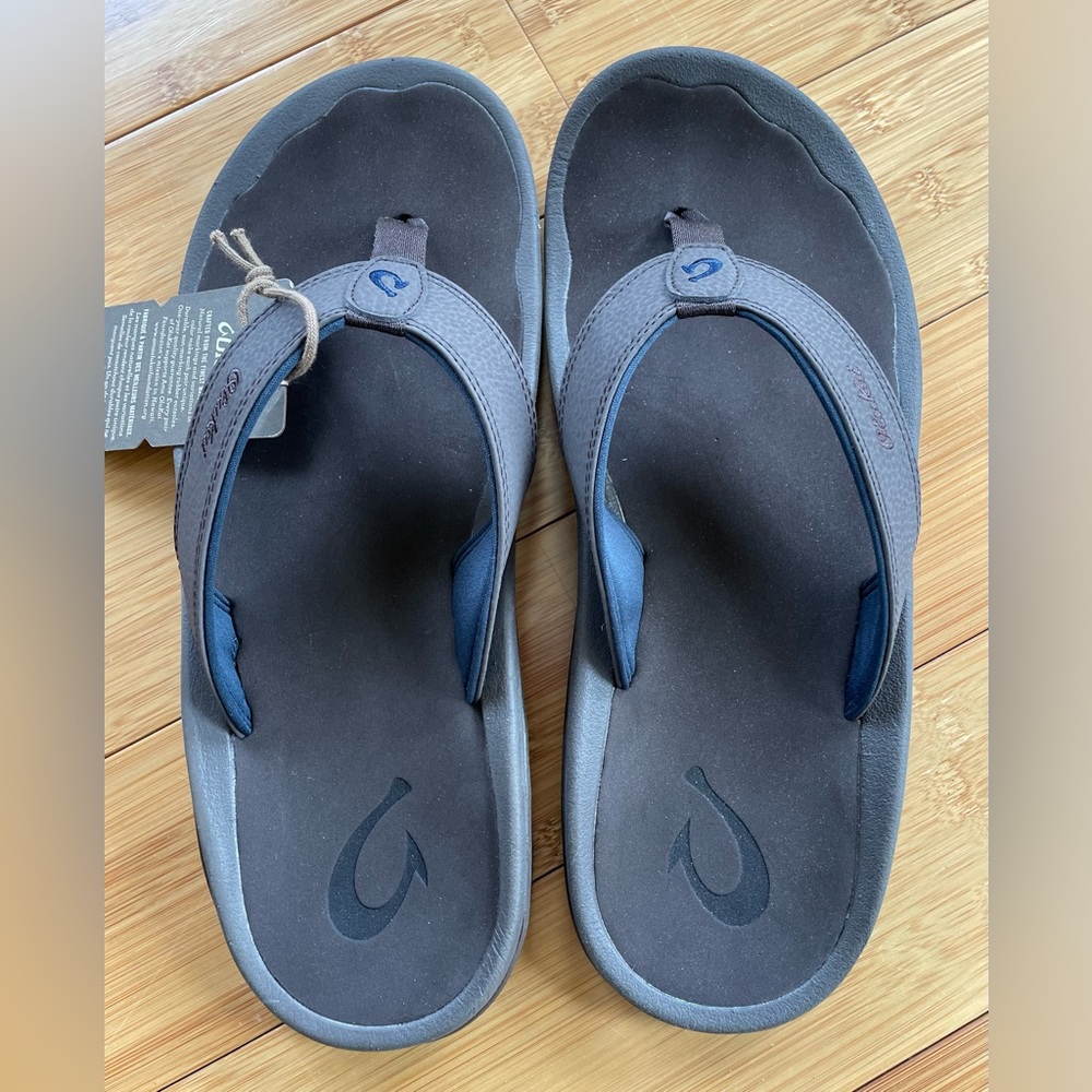 Crazy cobbler with another pair of Olukai’s. Dark wood. With tags